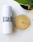 Marley's Monsters UNpaper® Towels + Wooden Holder shows white cotton flannel reusable paper towels rolled like paper towel