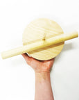 Wooden UNpaper® Towel Holder - Marley's Monsters being held up showing the removable dowel and base