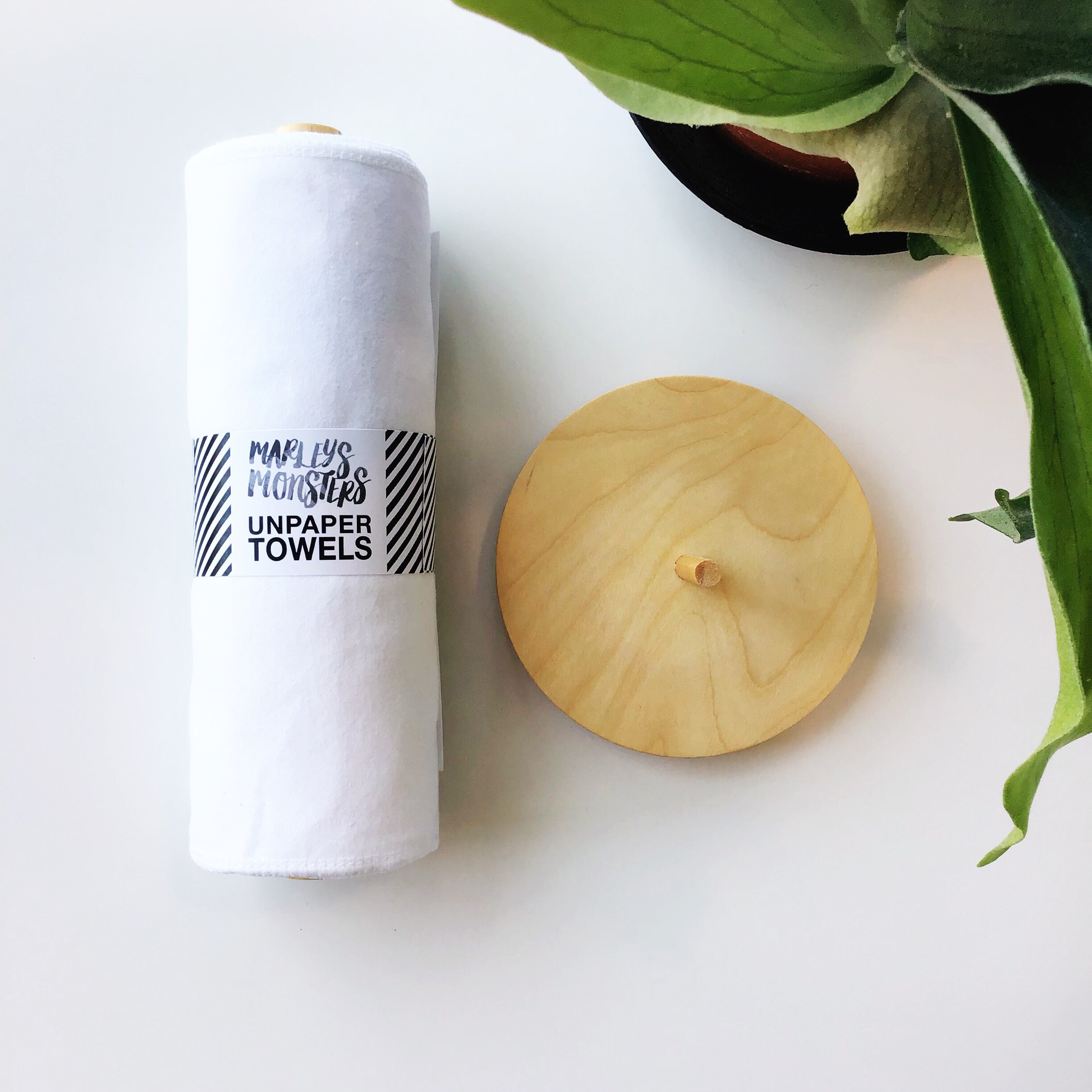 Marley&#39;s Monsters UNpaper® Towels + Wooden Holder shows white cotton flannel reusable paper towels rolled like paper towel