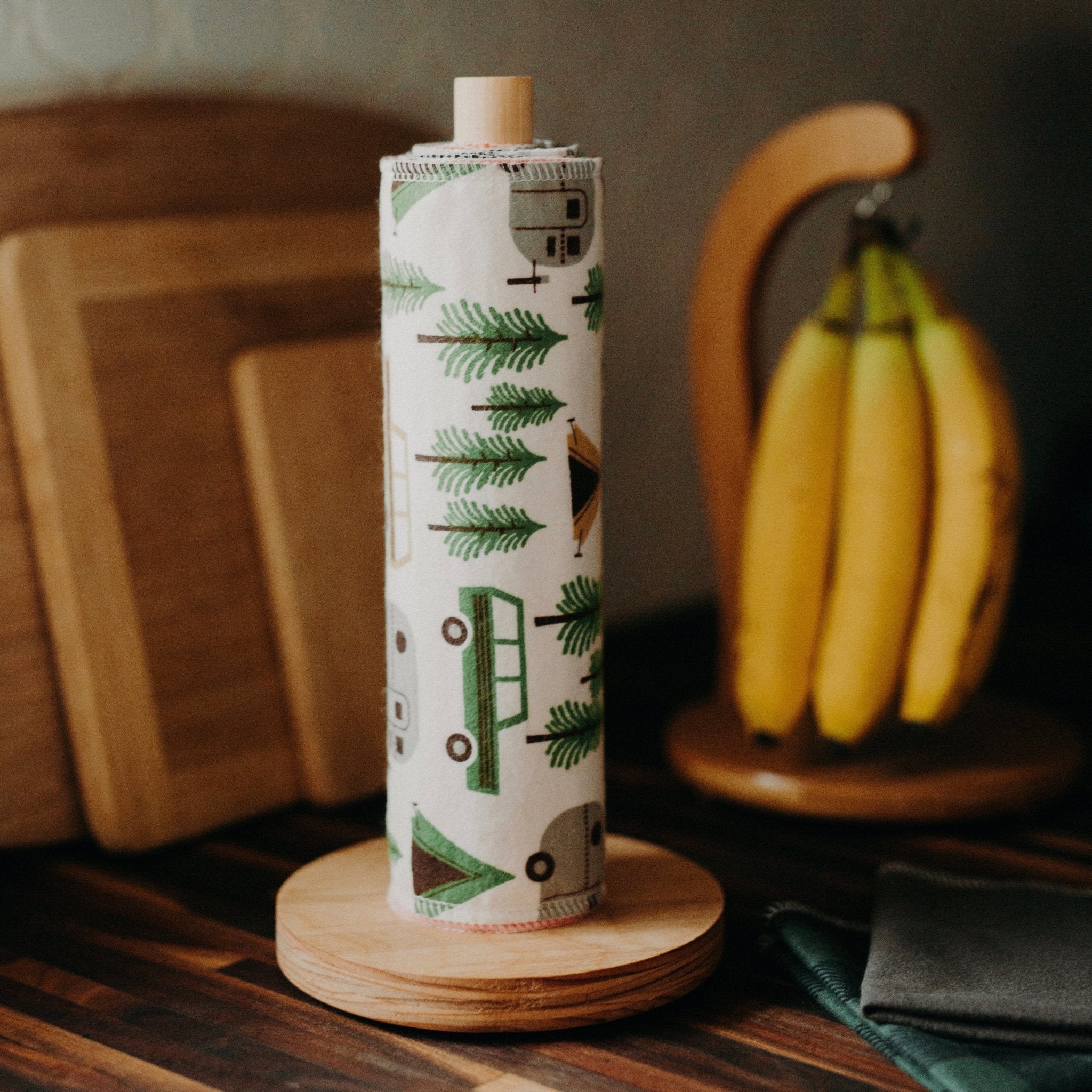 Marley&#39;s Monsters UNpaper® Towels + Wooden Holder shows cotton flannel reusable paper towels rolled like paper towels.