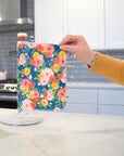 Shows a hand pulling off one UNpaper® Towel in the Marley's Favorites pack in the Fall Floral print. Marley's Monsters