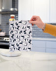 Shows a hand pulling off one UNpaper® Towel in the Marley's Favorites pack in the Pandas print. Marley's Monsters